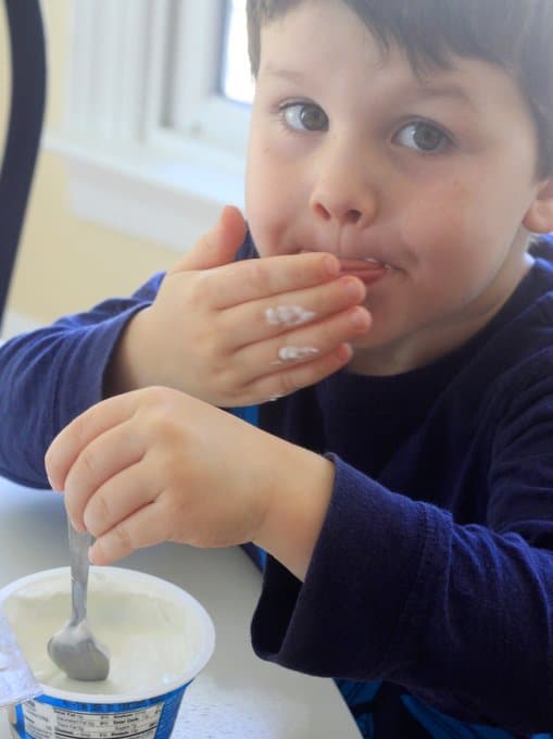 george stirring the yogurt for ghost pops