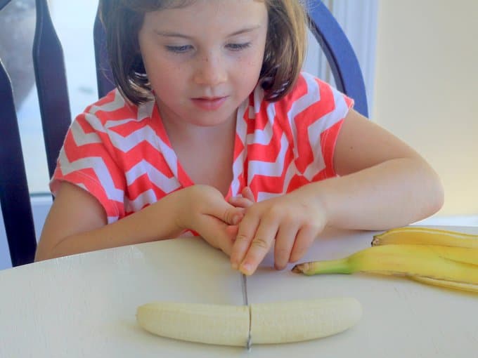 phoebe cutting the banana in half