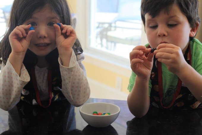 Estelle and George sorting M&Ms for christmas cookies