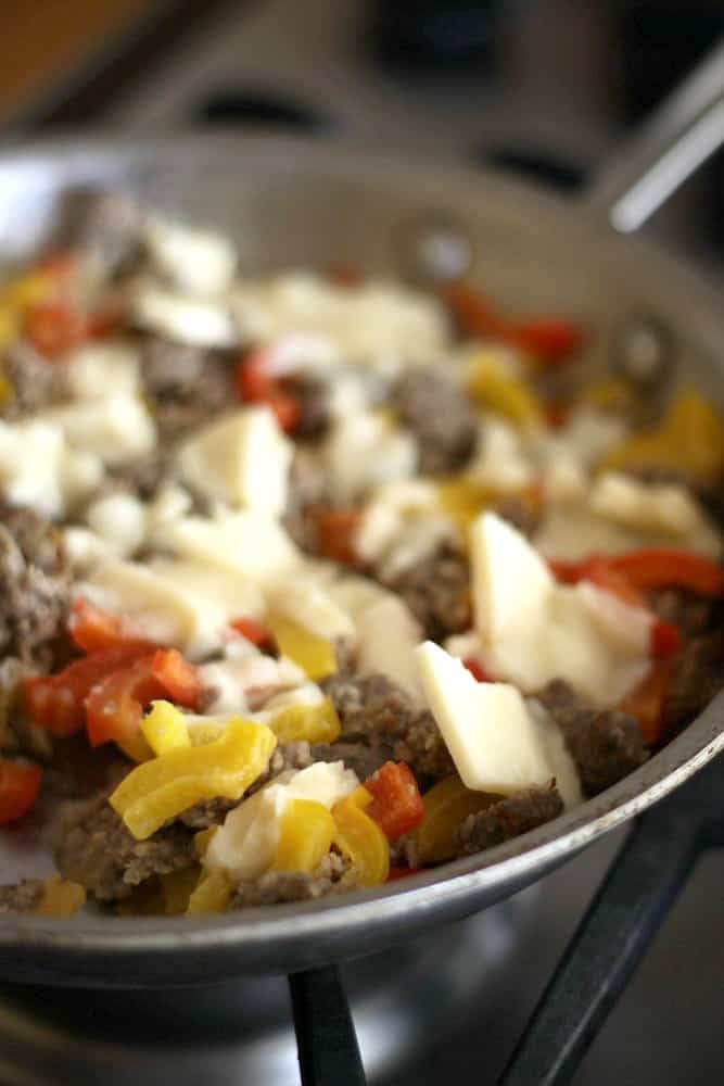 sausage and peppers in a pan