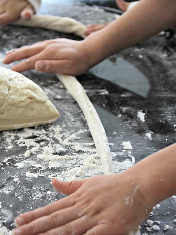 Rolling out dough for soft pretzel recipe
