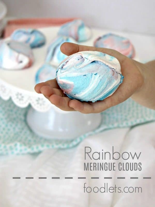 rainbow meringue cookies in hand